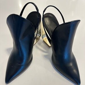 Cult Gaia, black leather sling back with architectural gold metal heels.